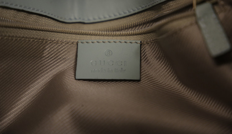 Gucci Logo Embossed Leather Mini Jackie Bag in Aqua