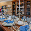 Farm Table Plate Setting with Candelabras and Blue Carousel Goblet