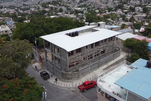 top down view - roof holds water tanks, other mechanicals, and collects rain water, view of neighborhood.